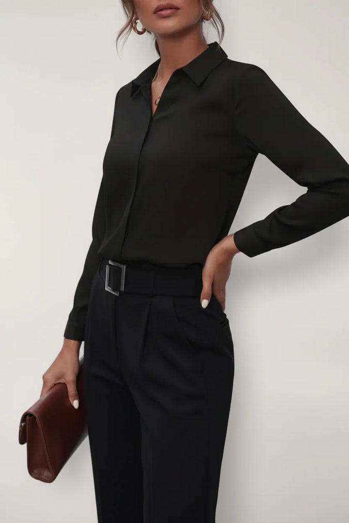 Side view of women's button-up blouse highlighting tailored waist shaping and long sleeves