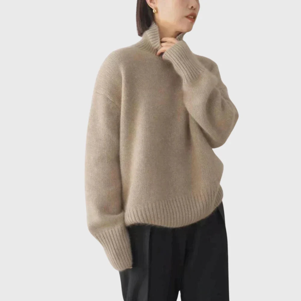 Detail of extended ribbed cuffs on women's turtleneck jumper with clean knit construction