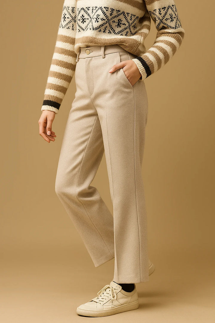 Woman wearing camel wool trousers in a professional office setting