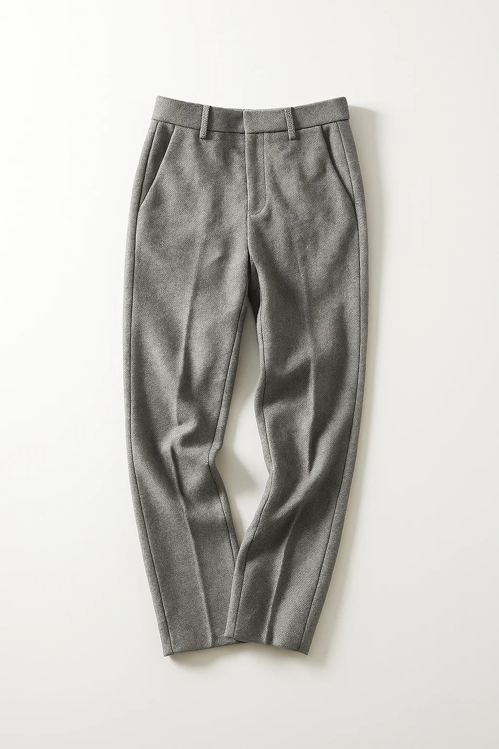 Side view of high-waist wool trousers showing flattering straight-leg silhouette