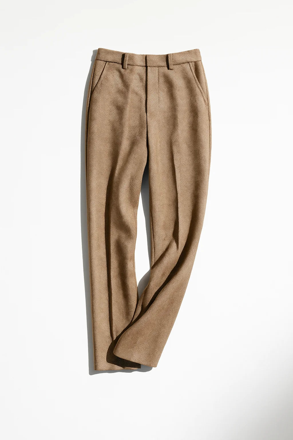 Detail of side pocket on herringbone wool trousers with clean stitching