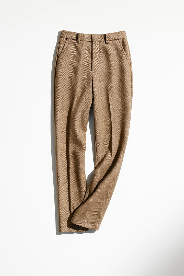 Detail of side pocket on herringbone wool trousers with clean stitching