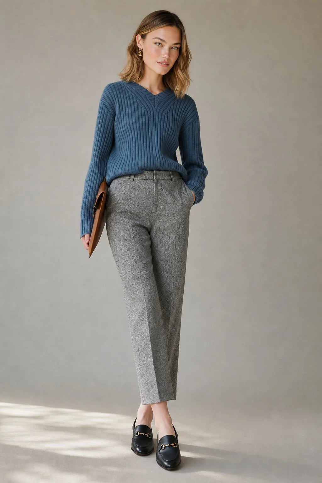 Side view of women's wool trousers displaying straight-leg silhouette and tailored fit