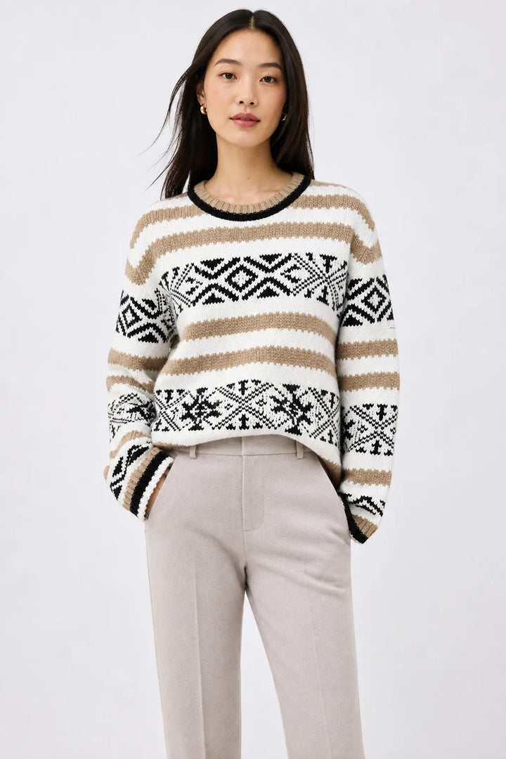Full-length view of herringbone wool trousers in camel tone with relaxed straight-leg cut