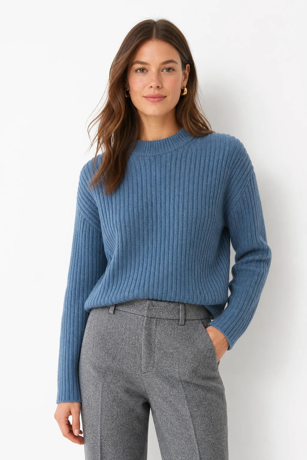 Wool trousers in ivory shade displaying herringbone pattern and structured drape