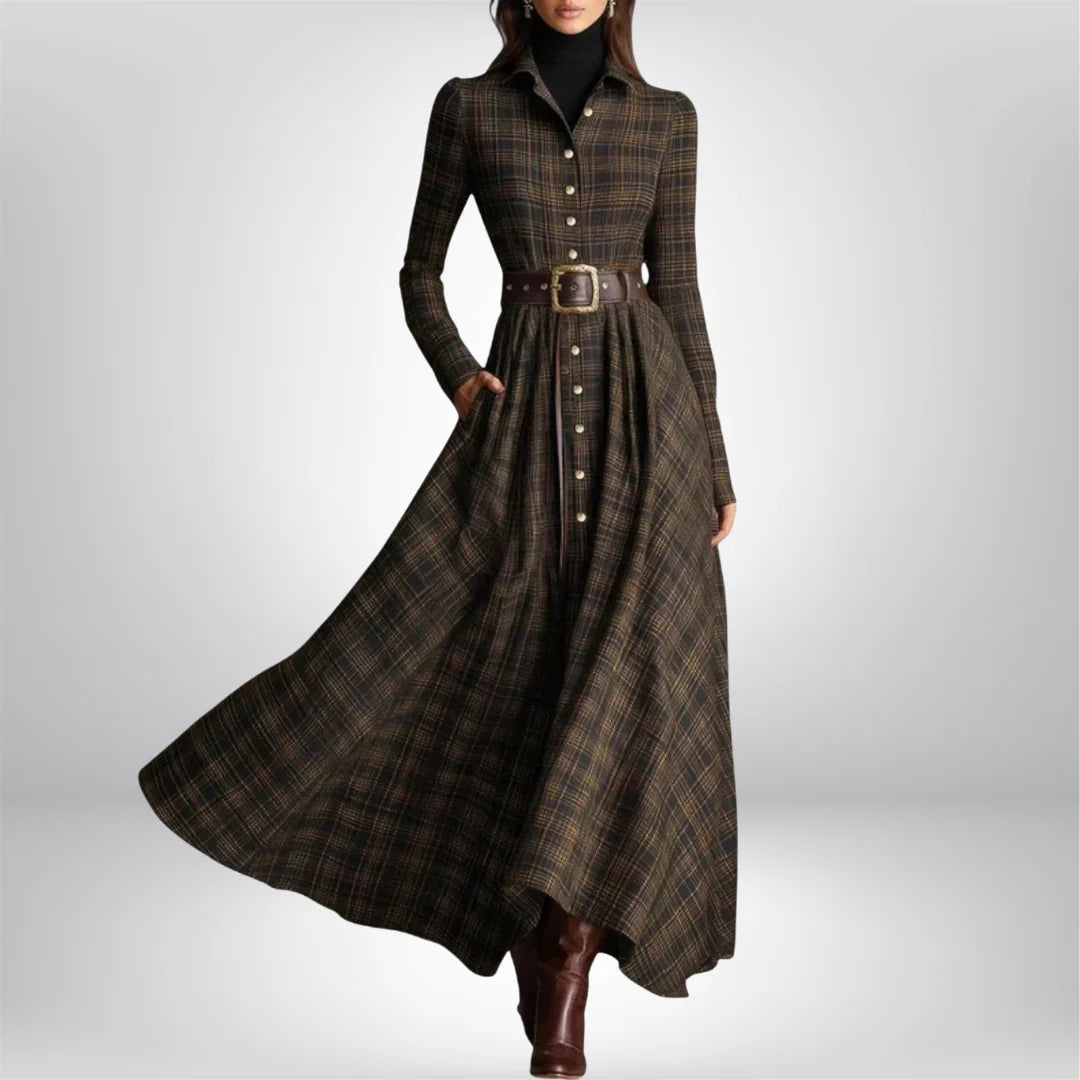Close-up of plaid belted shirt dress showing collared neckline and long sleeves with button closure