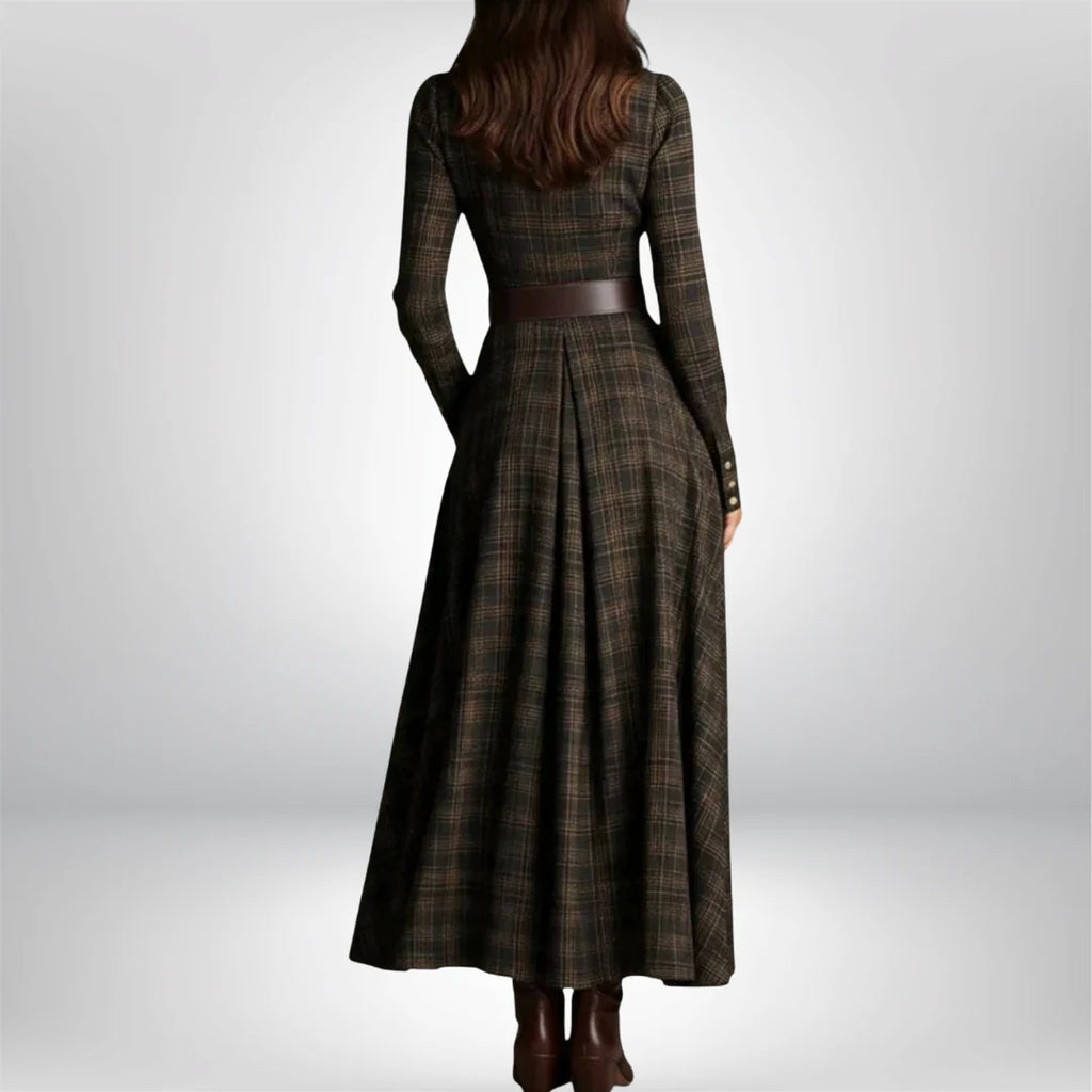 Detail of brown leather belt with gold buckle on plaid shirt dress