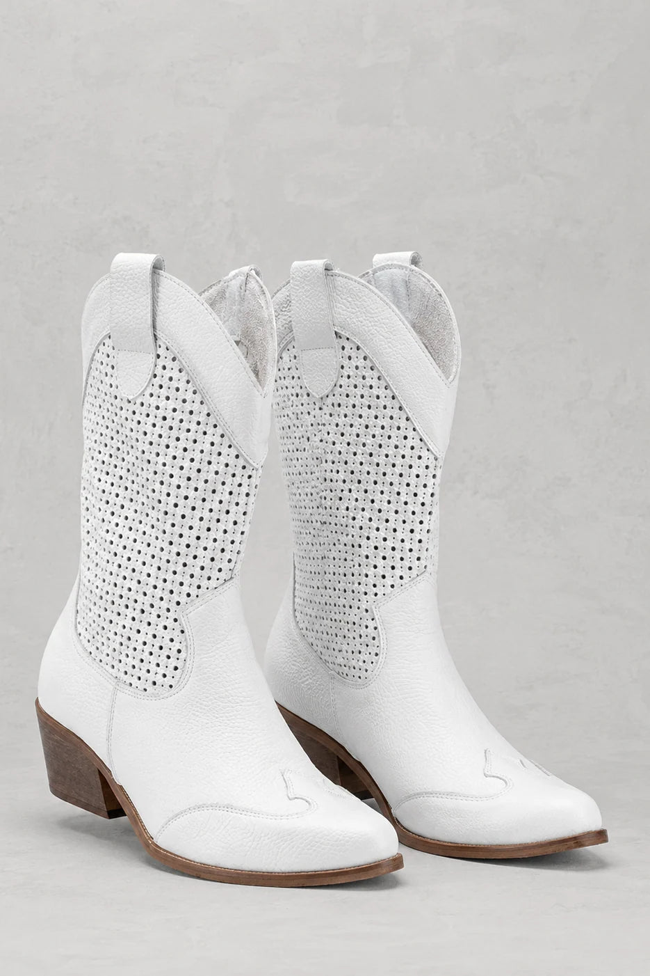Side view of women's Western cowboy boots showing mid-calf height and pull tabs