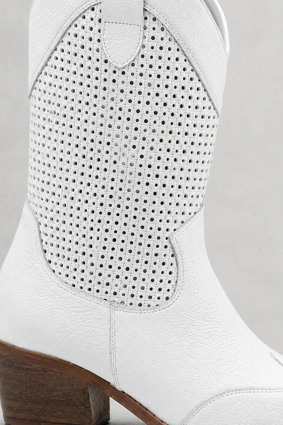 Rear view of women's block heel cowboy boots showing shaft construction and heel