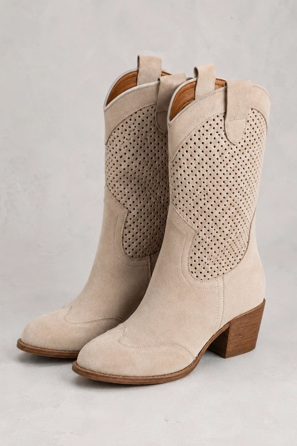 Detail shot of pull tabs and textured upper on women's mid-calf cowboy boots