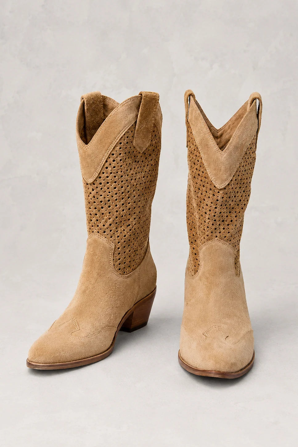 Women's cowboy boots styled on model showing fit and silhouette with casual outfit