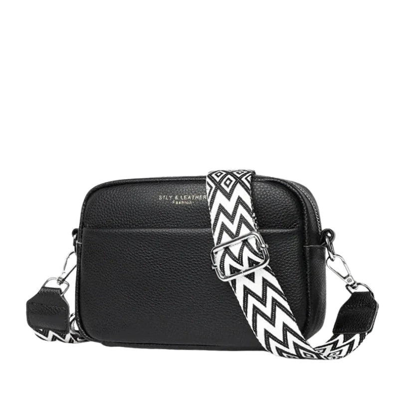 Teal textured crossbody bag with pebbled finish and silver-tone hardware showing front view