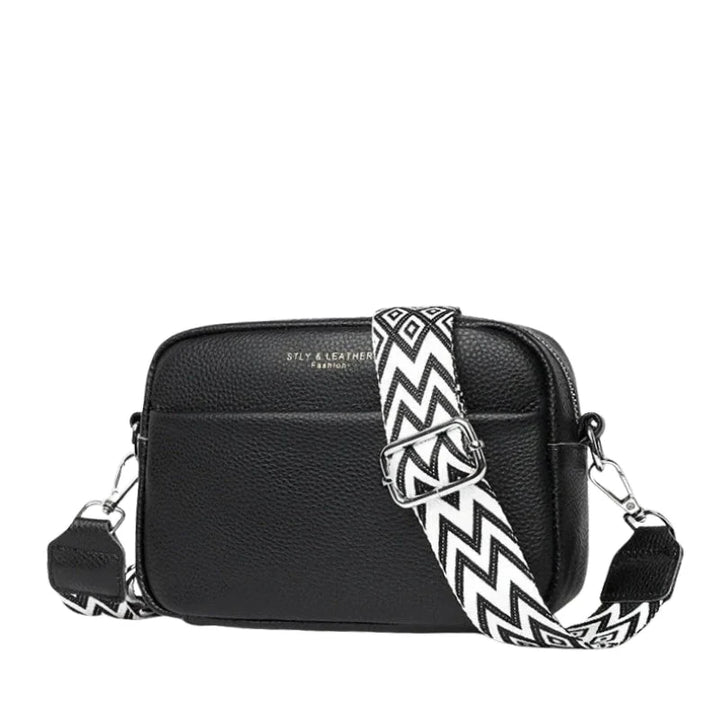 Teal textured crossbody bag with pebbled finish and silver-tone hardware showing front view