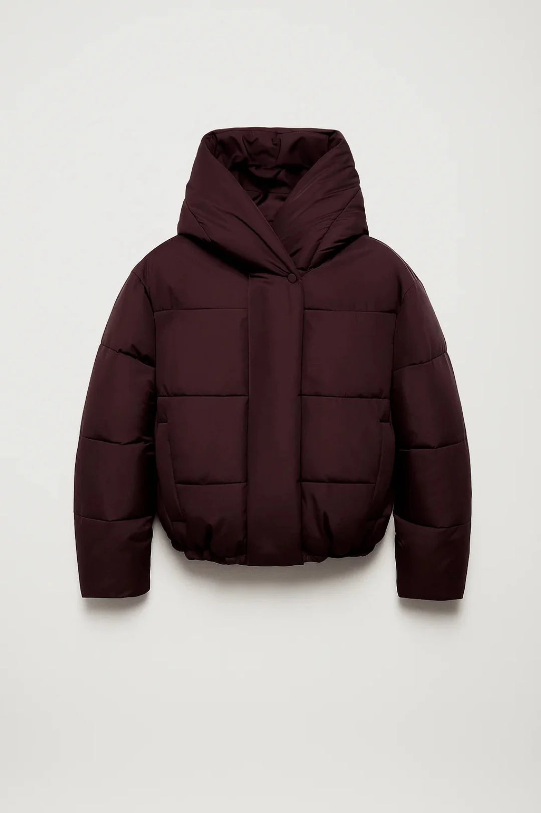 Women's oversized puffer jacket in burgundy with wide hood and cropped quilted design on neutral background