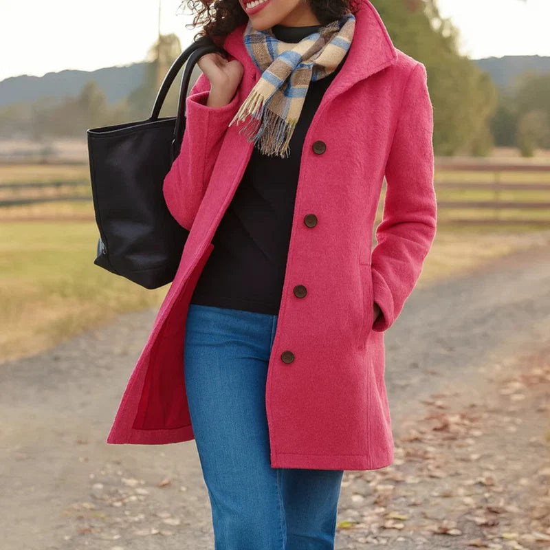 Full-length view of grey women's tailored wool-blend coat with mid-length cut below hip