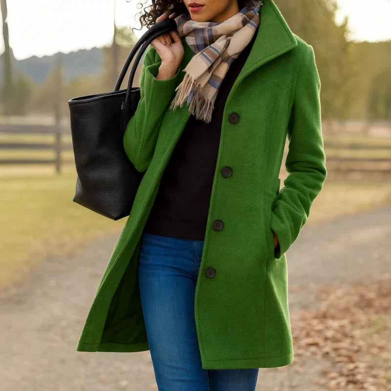 Woman in grey women's tailored wool-blend coat walking outdoors in autumn setting