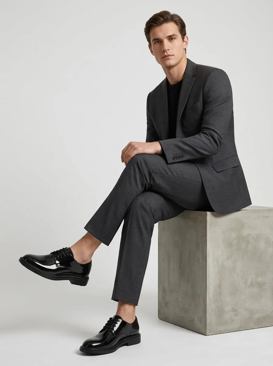 Rear view of men's derby shoes showing heel construction and ankle-high cut