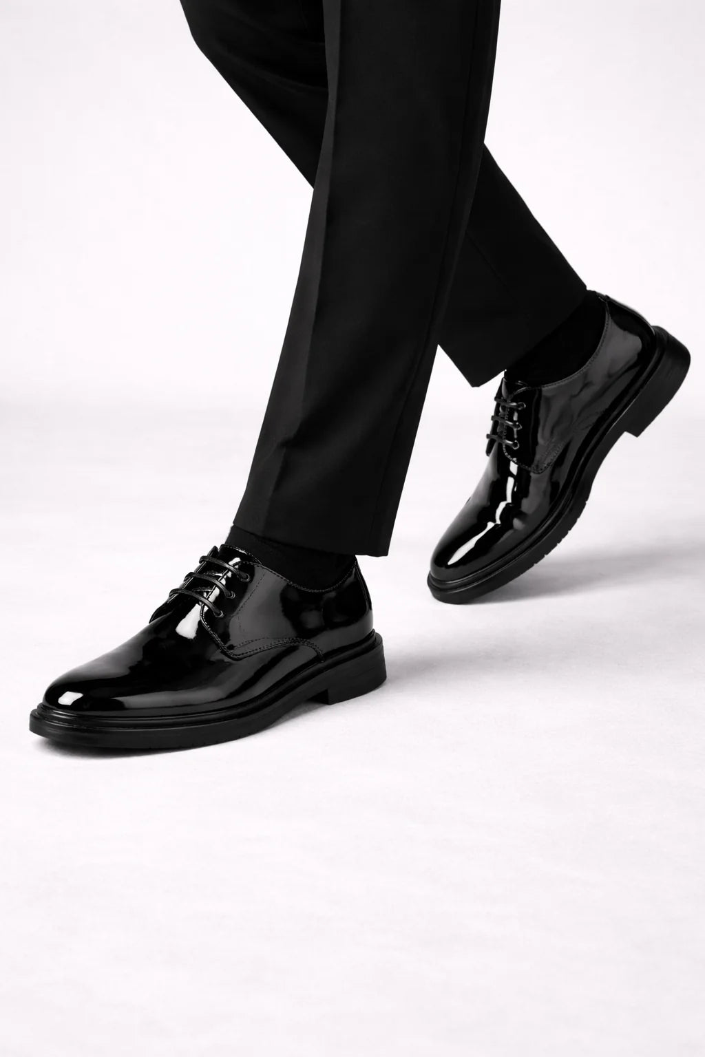 Detail shot of men's derby shoe construction showing structured upper and smooth finish