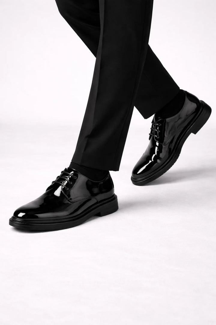 Detail shot of men's derby shoe construction showing structured upper and smooth finish