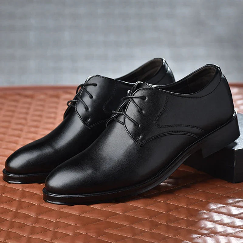 Side profile of men's formal derby shoes displaying clean lines and refined toe shape with durable outsole