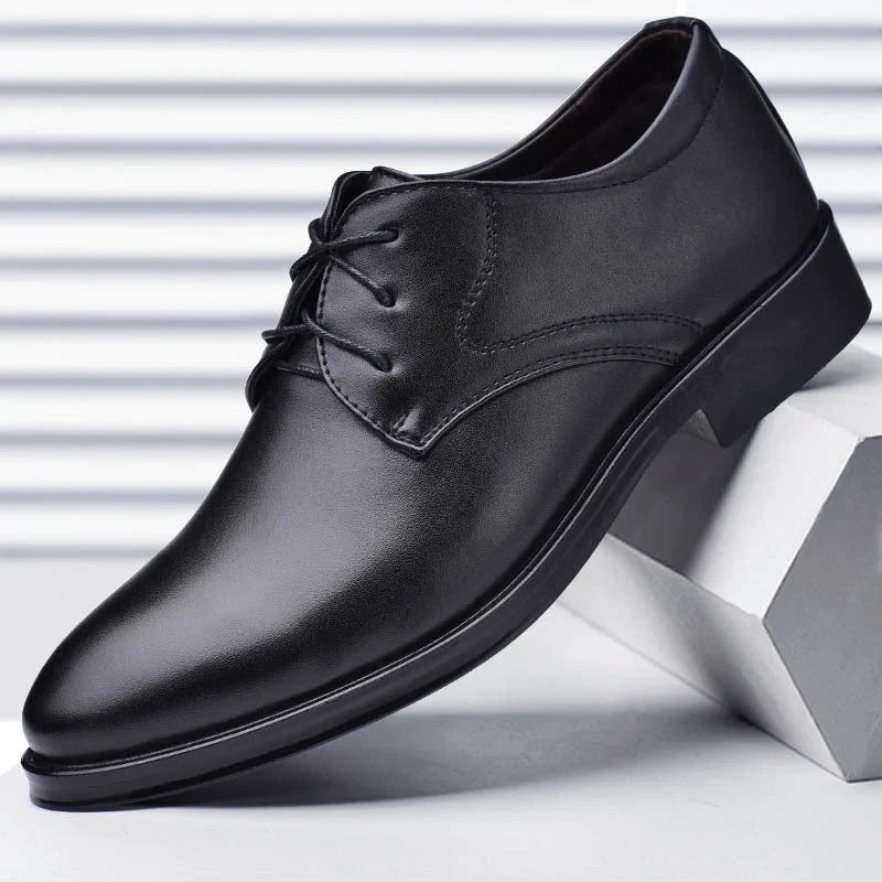 Detail shot of men's formal derby shoes highlighting polished finish and secure lace-up closure system