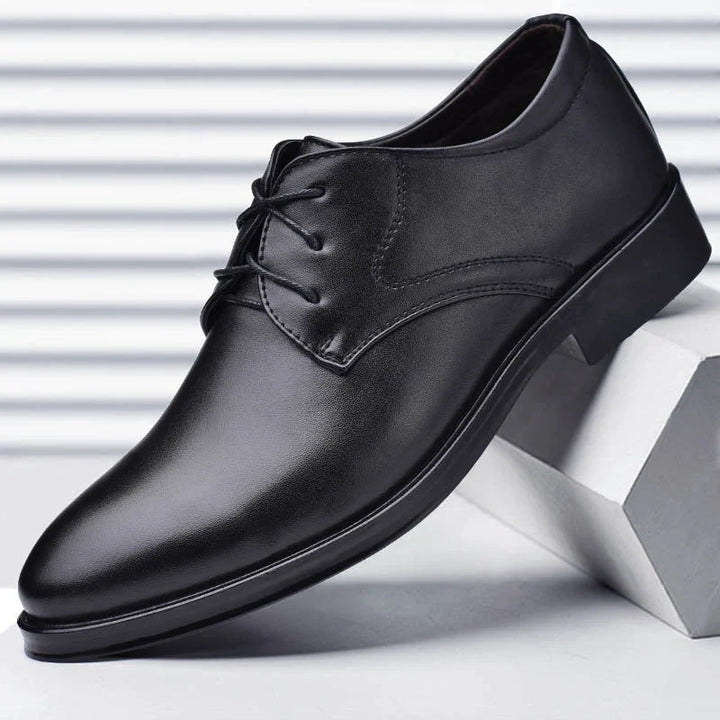 Detail shot of men's formal derby shoes highlighting polished finish and secure lace-up closure system