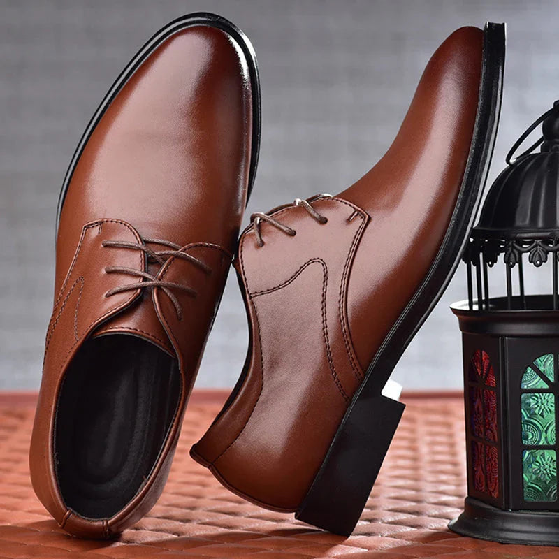 Men's brown derby shoes worn with formal trousers showing classic dress shoe styling and professional appearance