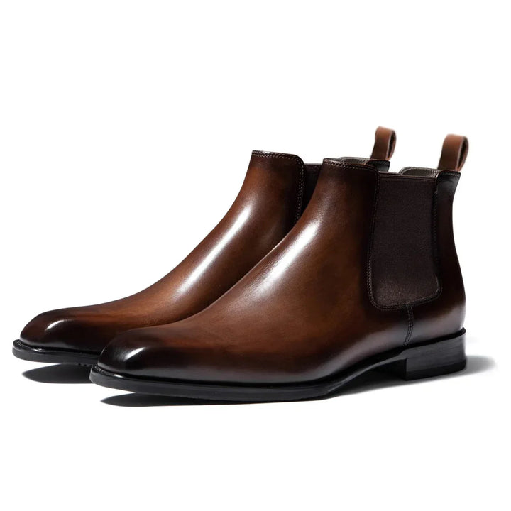 Rear view of men's Chelsea boots with back pull tab and stacked heel