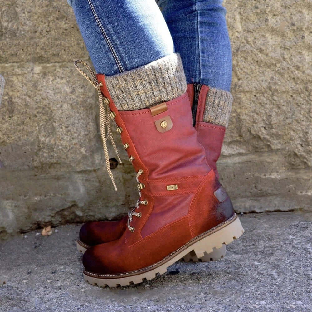 Close-up view of men's insulated winter boots showing lace-up front and water-resistant construction