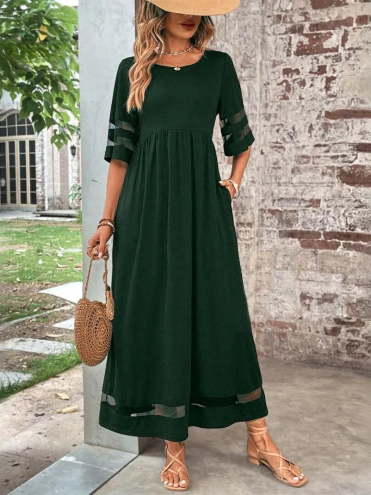 Side view of the ankle-length maxi dress with round neckline and three-quarter mesh sleeves