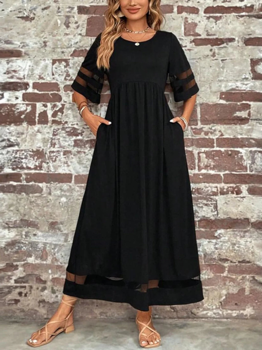 Full-length view of the maxi dress paired with sandals for a relaxed daytime look