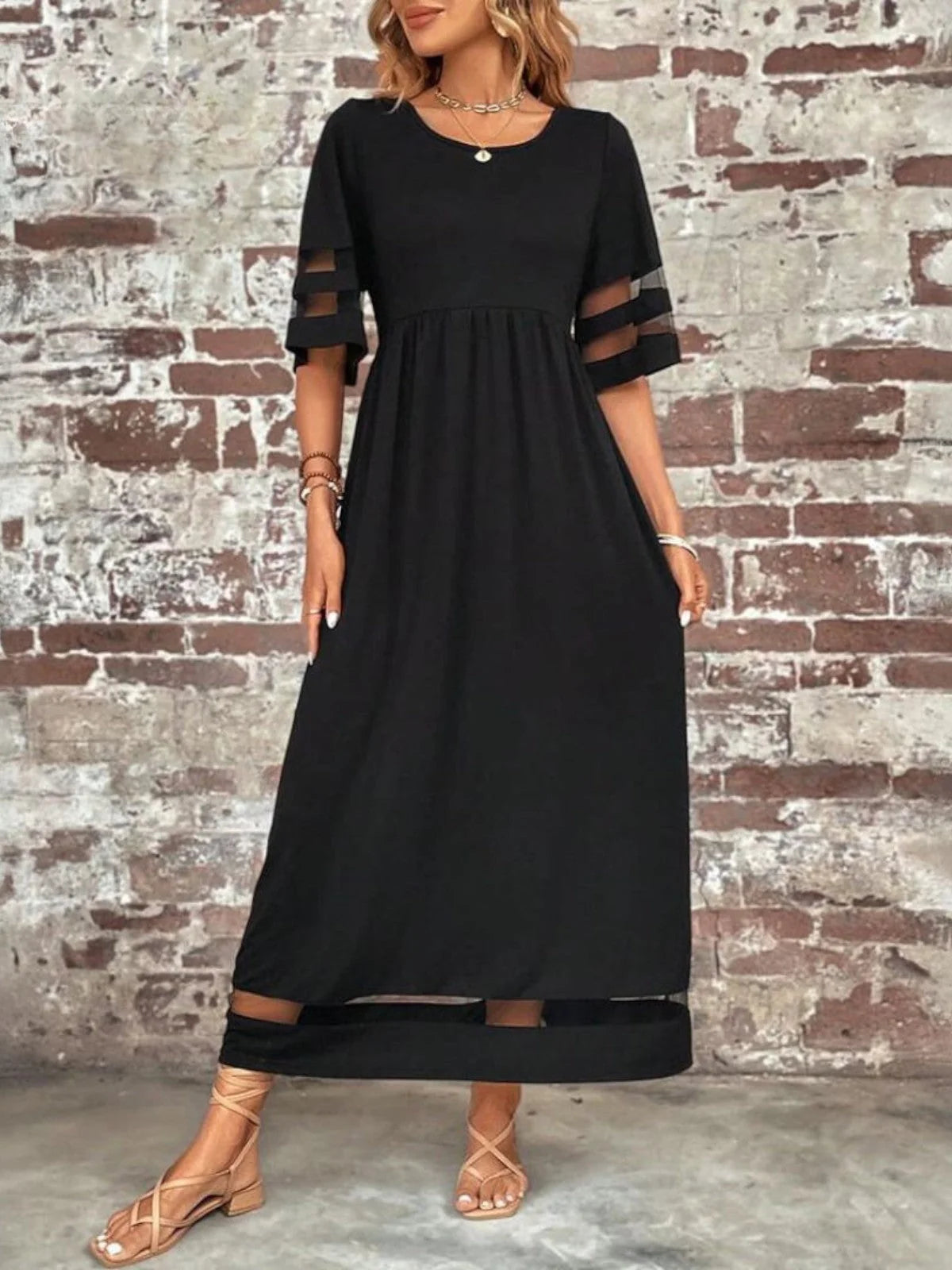 Woman styled in the mesh detail maxi dress with accessories for a casual outdoor occasion
