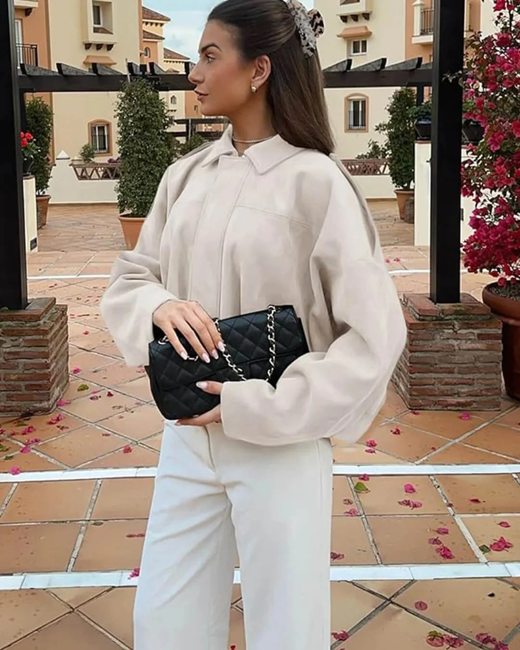 Close-up of women's collared bomber jacket elasticated cuffs and sleeve detail