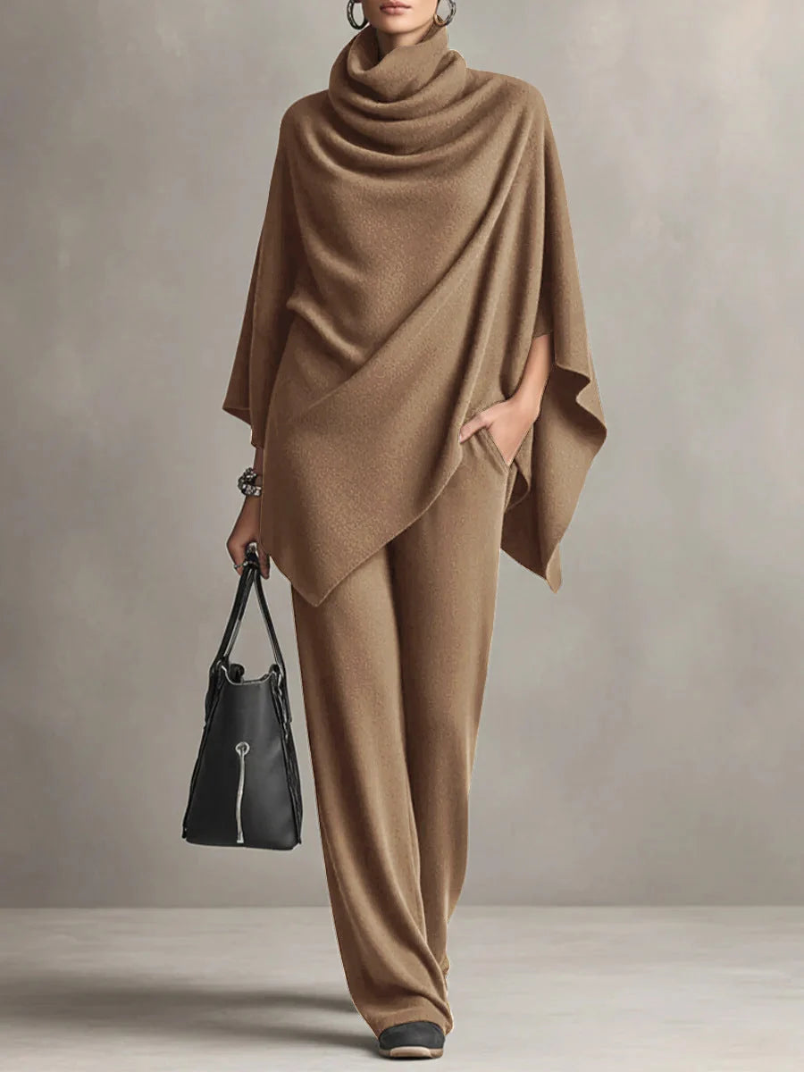 Close-up of cowl neck draping detail on black two-piece set top