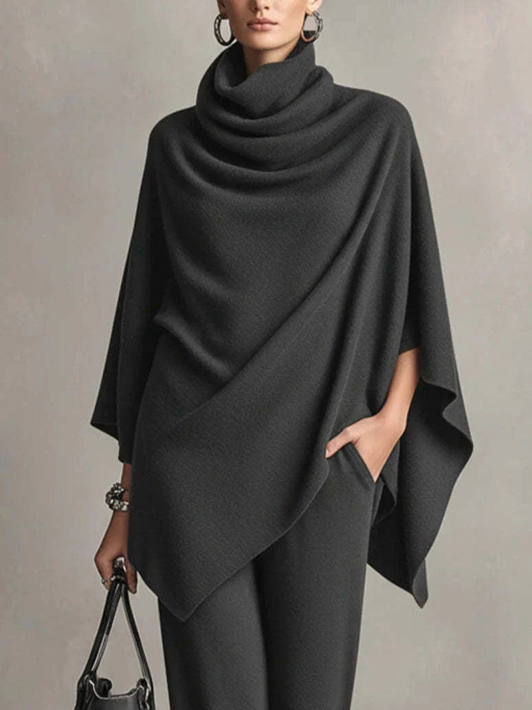 Back view of women's black two-piece set showing flowing fabric drape