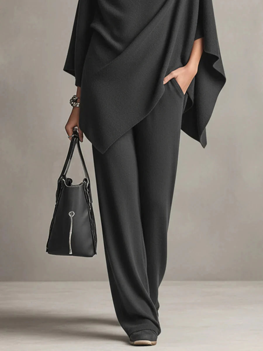 Styling detail of black cowl neck set paired with minimal accessories