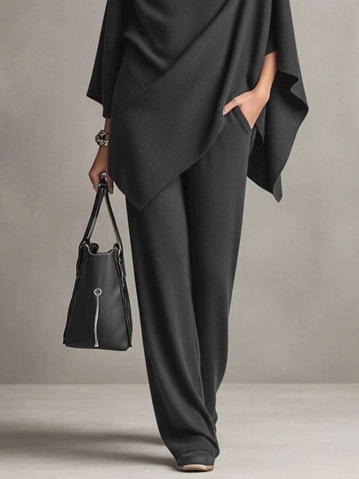 Styling detail of black cowl neck set paired with minimal accessories