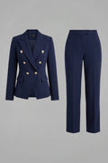 Women's navy double-breasted blazer suit set with tailored trousers and gold button detailing on neutral background