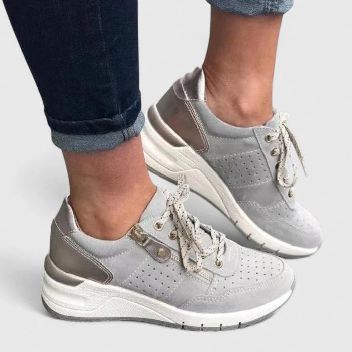 Women's orthopaedic trainers in mint green featuring lace-up closure and textured rubber outsole for grip.