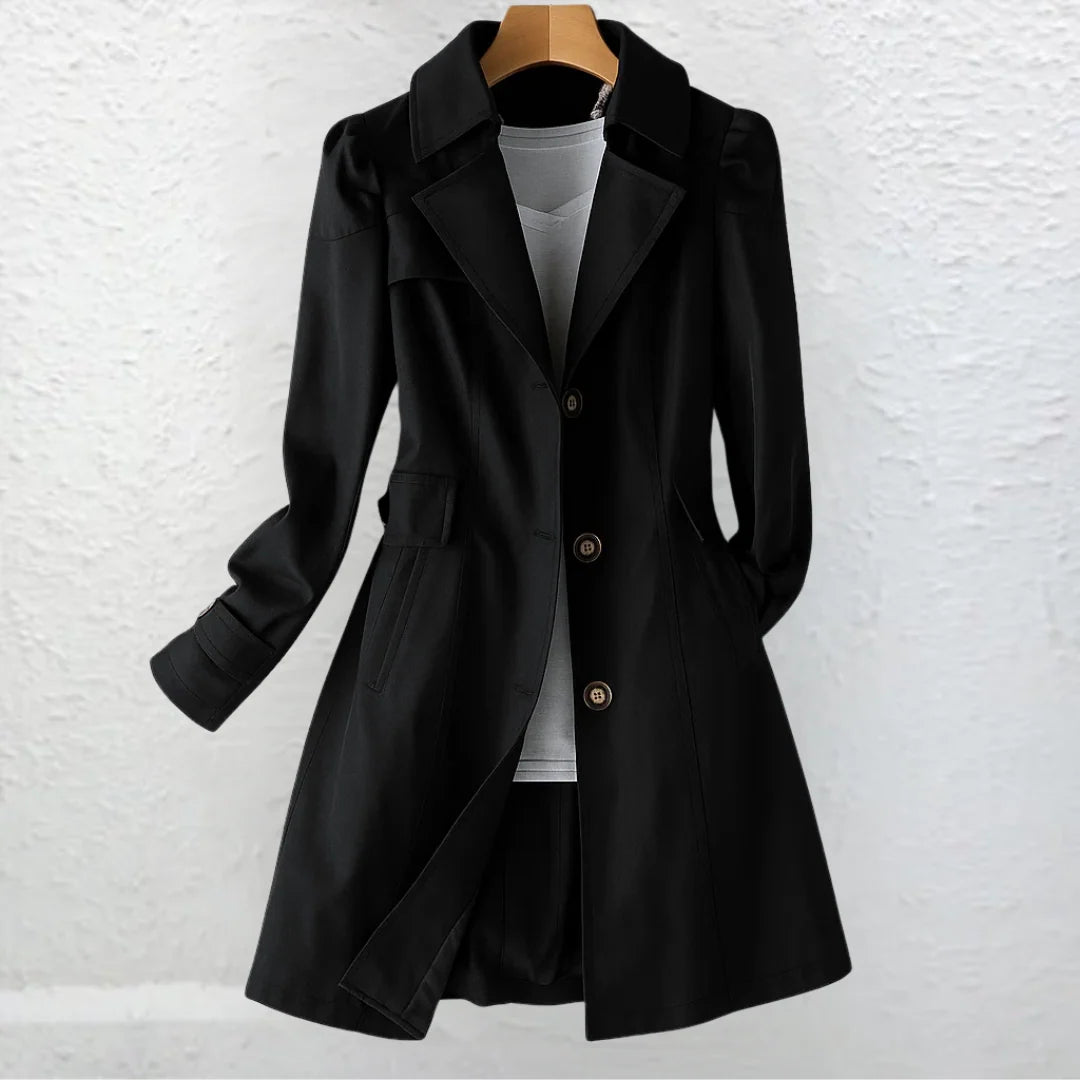 Women's beige trench coat showing classic collar and structured fit on hanger
