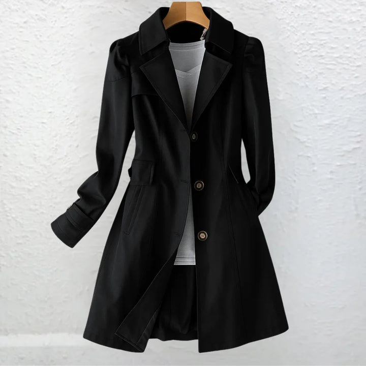 Women's beige trench coat showing classic collar and structured fit on hanger