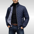 Close-up of diamond quilted pattern and plush fleece lining on men's bomber jacket