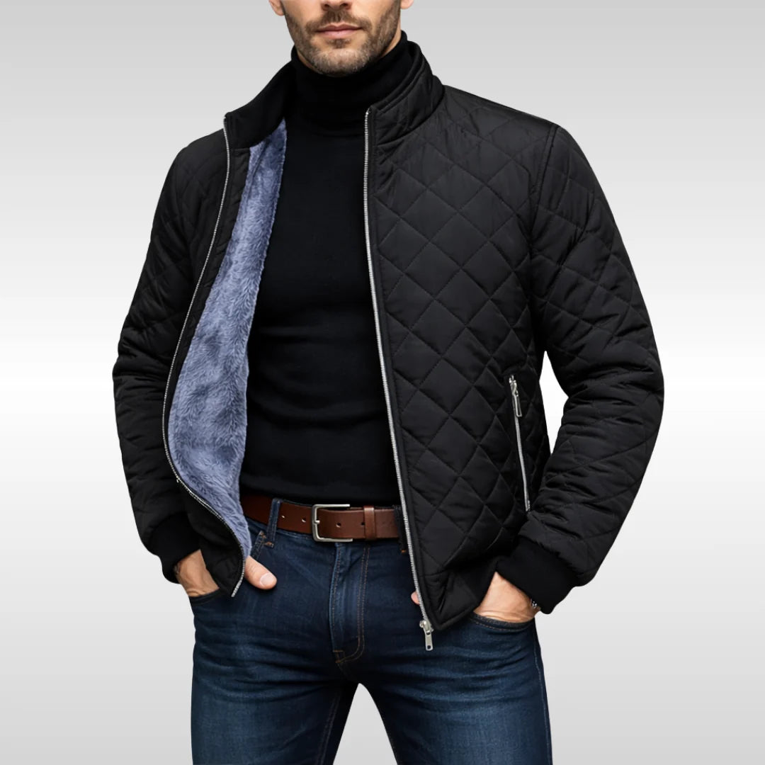 Side view of men's navy quilted jacket showing relaxed fit and ribbed cuffs