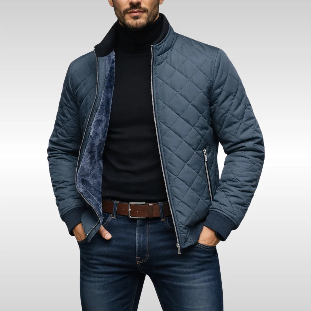 Detail of full-length zip closure and side zip pocket on quilted bomber jacket