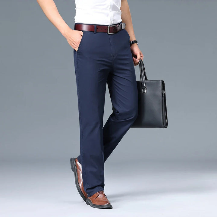 Close-up of front pocket detail on men's tailored dress trousers with clean stitching