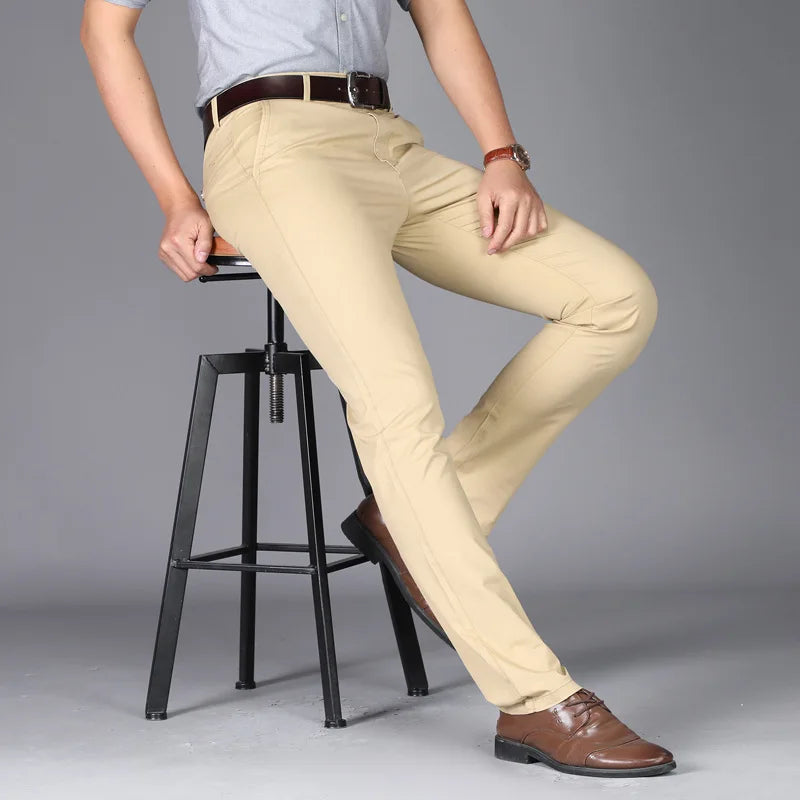 Side view of men's slim fit trousers in khaki with streamlined cut and polished finish