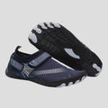 Men's water shoes in navy with textured rubber sole and adjustable strap for secure fit