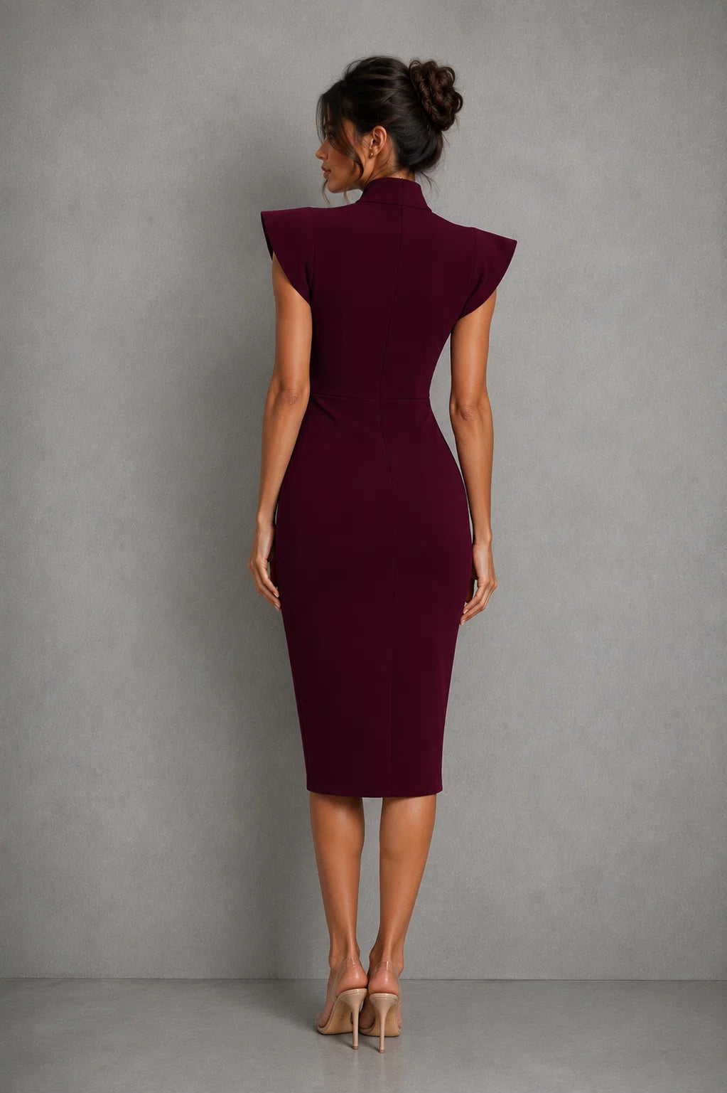 Side profile of midi dress with flutter sleeves and slim-fit silhouette for office wear