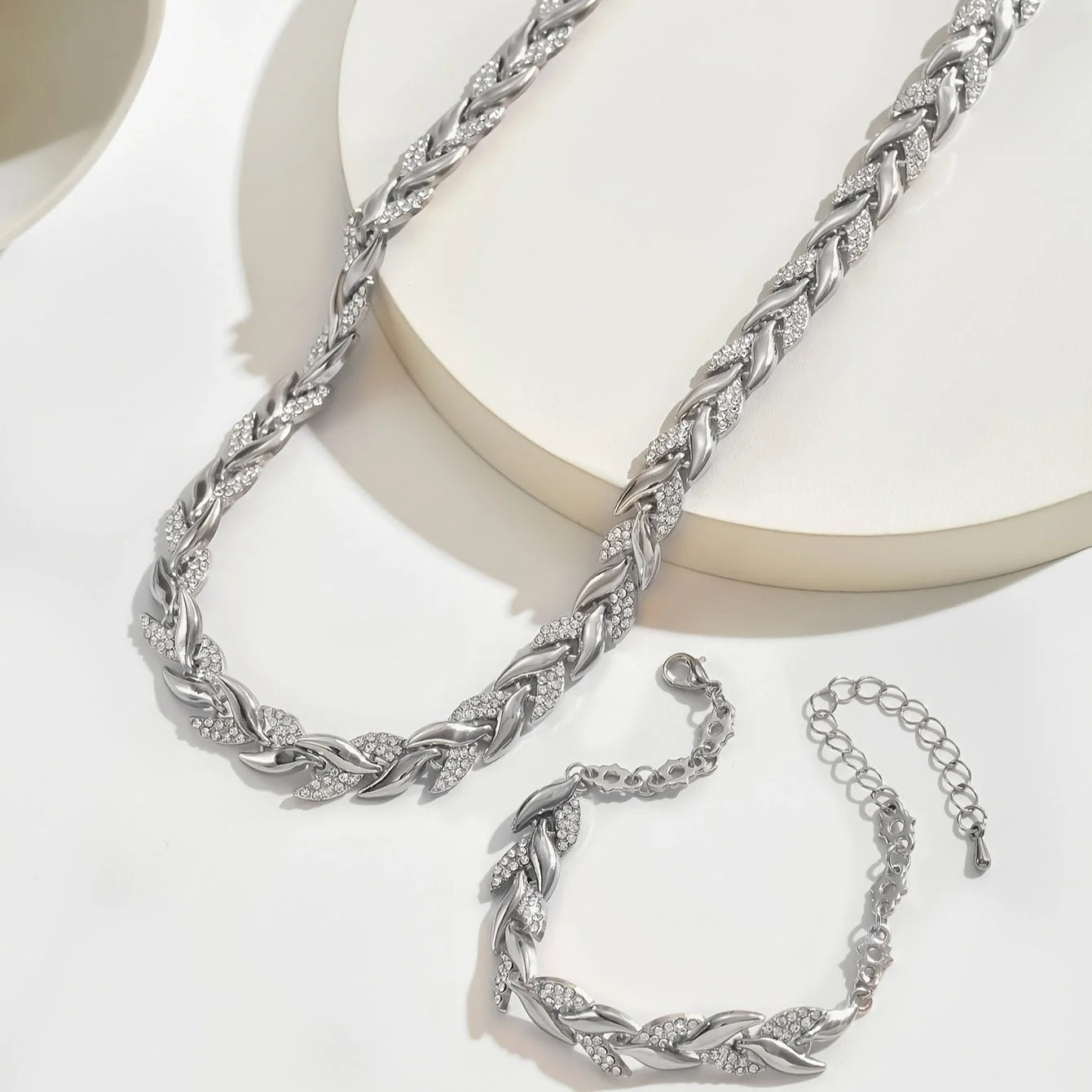 Woman styling rhinestone chain necklace set with evening wear for formal occasion
