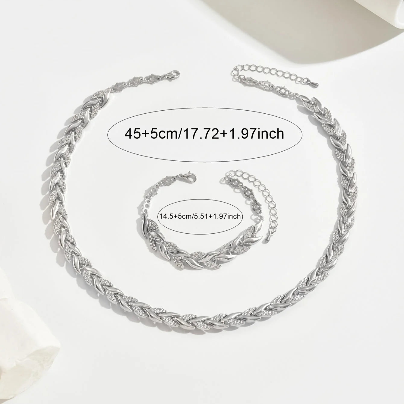 Detail of rhinestone chain necklace links showing alternating smooth and crystal sections